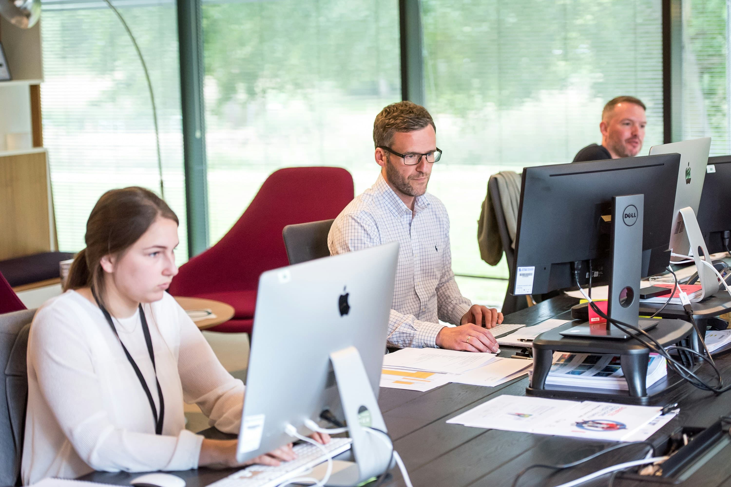 Operations team working at computer workstations
